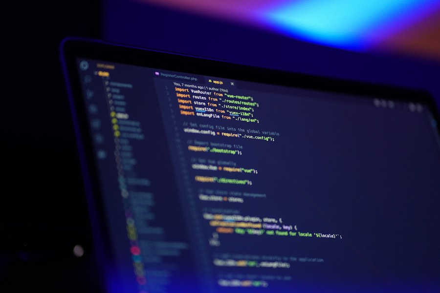 Laptop screen showing colourful website code